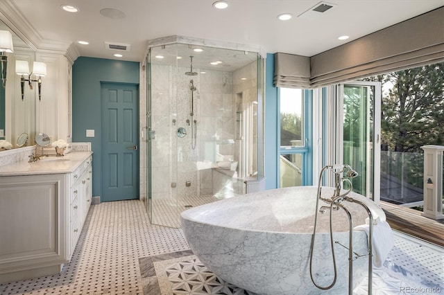 bathroom featuring vanity and plus walk in shower