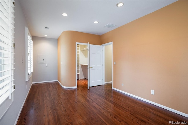 empty room with dark hardwood / wood-style floors