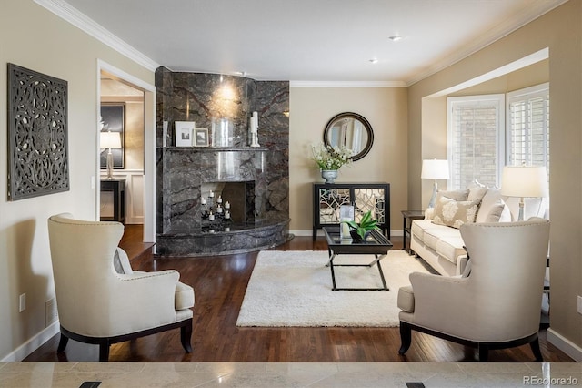 living room with crown molding, a high end fireplace, and dark hardwood / wood-style floors