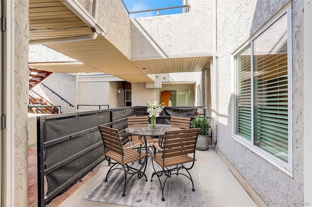 view of patio / terrace with outdoor dining area and a balcony