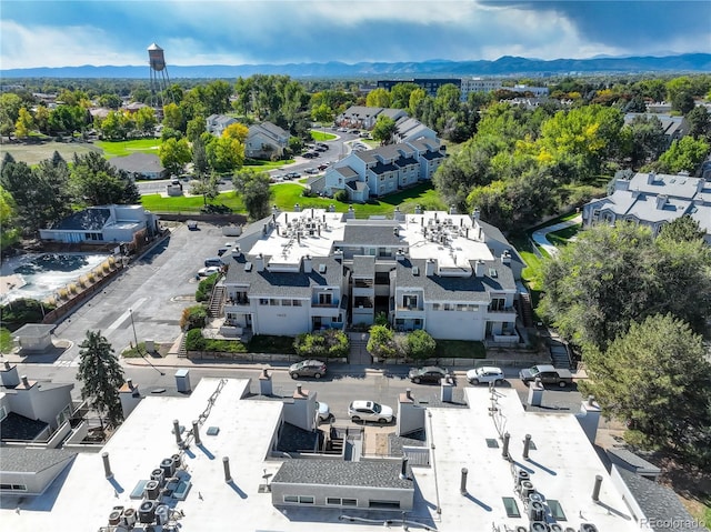 drone / aerial view featuring a residential view and a mountain view