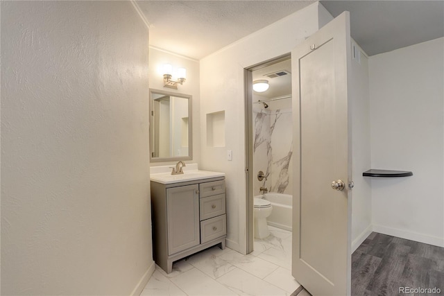 full bath featuring toilet, shower / washtub combination, vanity, visible vents, and baseboards