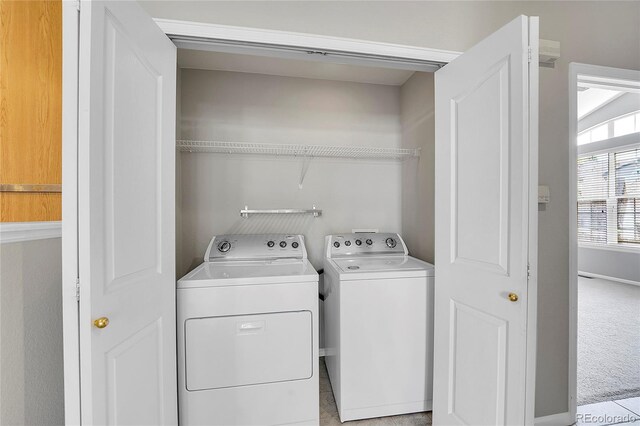 14333 E Napa Pl Unit 5D, Aurora, CO 80014 - laundry area with washing machine and dryer and baseboards