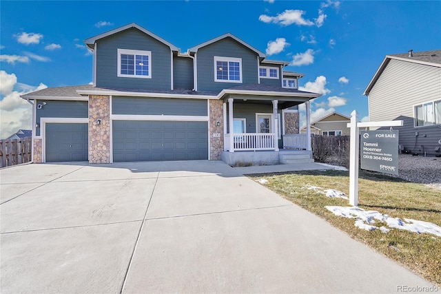 view of front of house with a garage and a porch