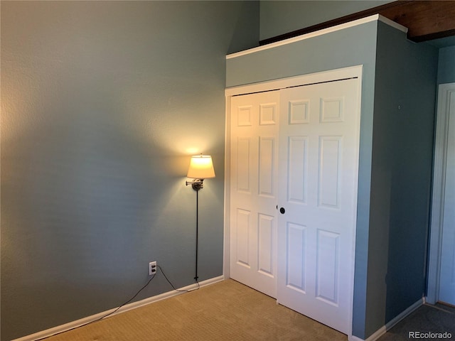 68 Golf Course Dr Unit 11, Copper Mountain, CO 80443 - unfurnished bedroom with light carpet, a closet, and baseboards