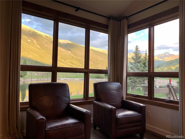 68 Golf Course Dr Unit 11, Copper Mountain, CO 80443 - living area with baseboards and a mountain view