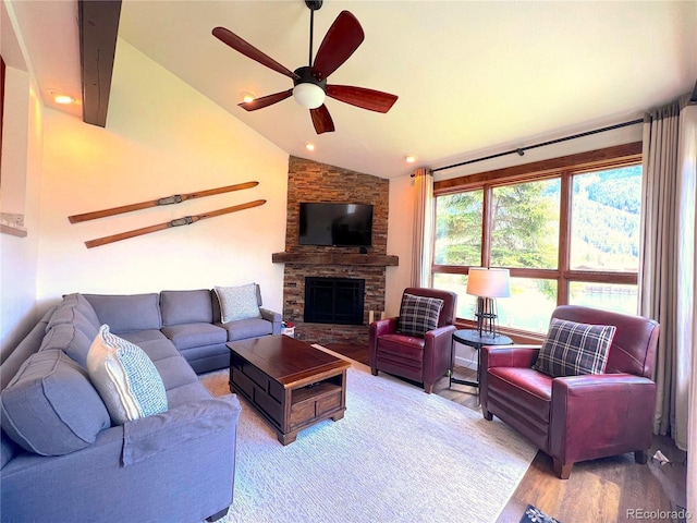 68 Golf Course Dr Unit 11, Copper Mountain, CO 80443 - living area with lofted ceiling, a ceiling fan, wood finished floors, and a fireplace