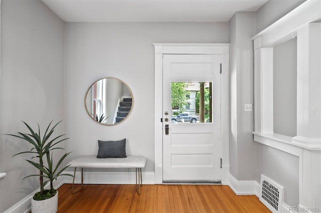 foyer featuring light wood-type flooring and baseboards