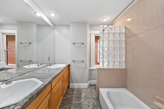 bathroom with baseboards, a tub, marble finish flooring, a shower, and recessed lighting