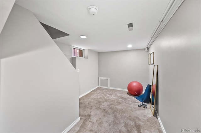 exercise room with carpet flooring, recessed lighting, and baseboards
