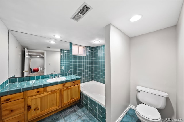 full bathroom featuring toilet, vanity, tiled shower / bath combo, tile patterned flooring, and recessed lighting