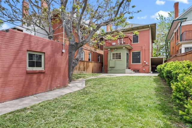 back of property featuring a balcony, a patio area, and entry steps
