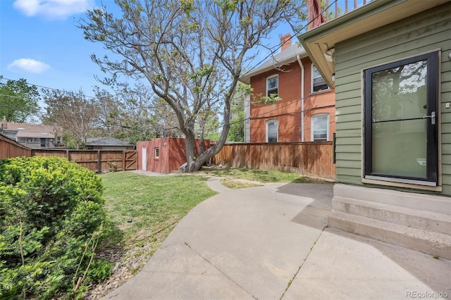 view of yard featuring a patio area and entry steps