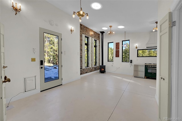 148 Ridge Ln, Bailey, CO 80421 - entrance foyer with a wood stove and concrete floors