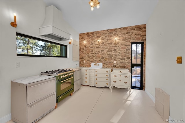 148 Ridge Ln, Bailey, CO 80421 - kitchen featuring high end black range oven, premium range hood, healthy amount of natural light, light countertops, and vaulted ceiling