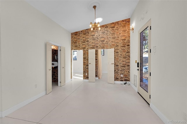 148 Ridge Ln, Bailey, CO 80421 - unfurnished dining area with finished concrete flooring and a chandelier