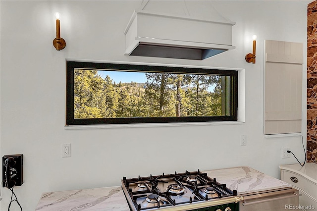 148 Ridge Ln, Bailey, CO 80421 - kitchen featuring stainless steel stovetop and marble look tiles