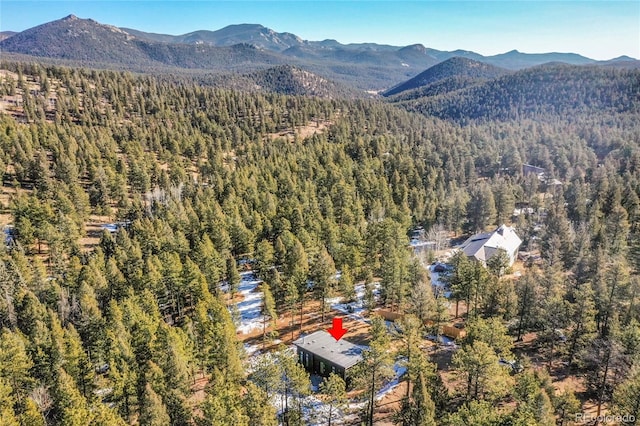 148 Ridge Ln, Bailey, CO 80421 - aerial view of a heavily wooded area and a mountainous background