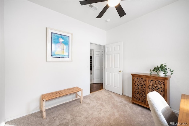 office area featuring ceiling fan and light carpet