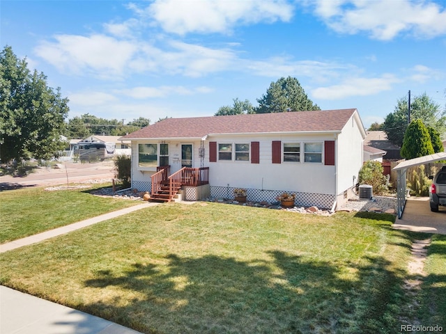 view of front of house with central AC unit and a front lawn