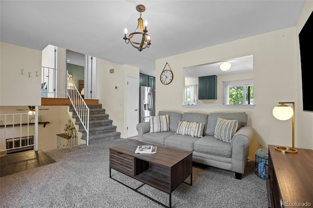 1153 S Biscay St, Aurora, CO 80017 - living room featuring carpet floors, a chandelier, stairway, and a ceiling fan
