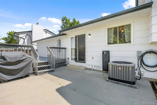 1153 S Biscay St, Aurora, CO 80017 - view of patio / terrace with cooling unit and a deck