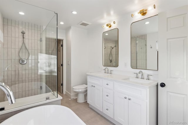 bathroom with double vanity, a stall shower, visible vents, and a sink