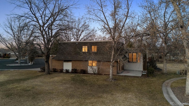 view of front of home featuring brick siding