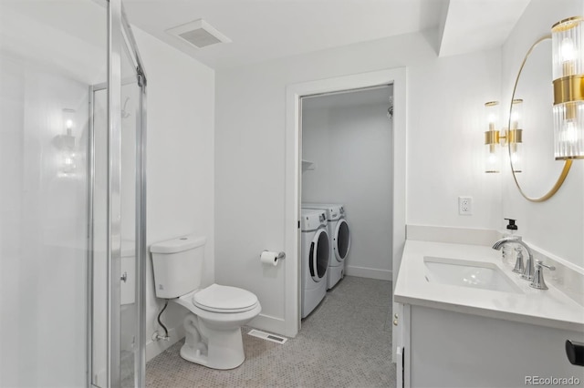 full bathroom featuring a stall shower, washing machine and dryer, visible vents, and toilet