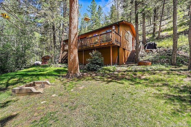 view of yard featuring a wooden deck