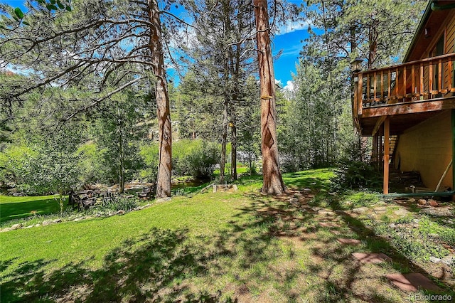 view of yard with a wooden deck