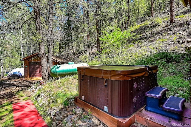 exterior space with a hot tub