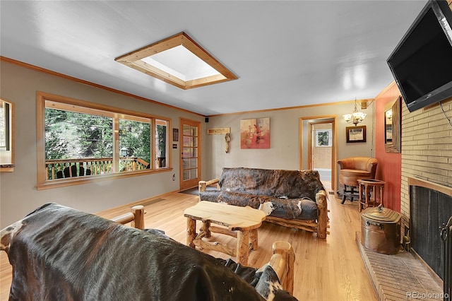 living room with ornamental molding, light hardwood / wood-style floors, and brick wall