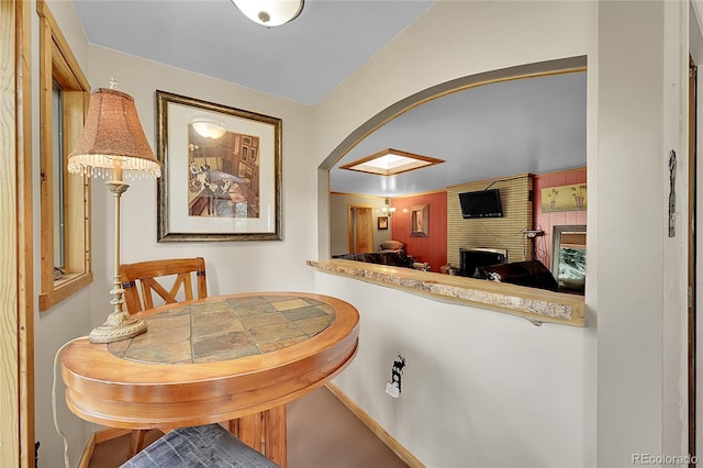 dining space featuring a fireplace