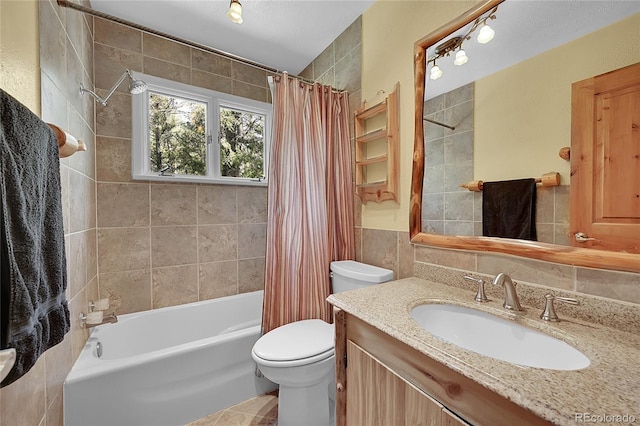 full bathroom with vanity, tasteful backsplash, shower / tub combo, tile walls, and toilet