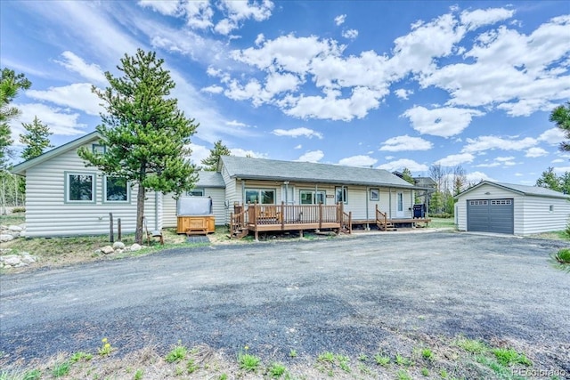 38 D Rd, Silverthorne, CO 80498 - ranch-style home with an outbuilding, a detached garage, and a deck