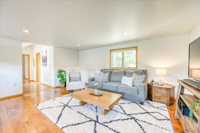 38 D Rd, Silverthorne, CO 80498 - living area with wood finished floors, recessed lighting, baseboards, and a textured ceiling