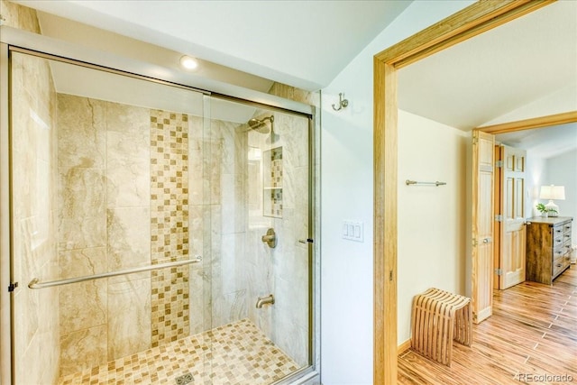 38 D Rd, Silverthorne, CO 80498 - full bath with a stall shower, wood finished floors, vaulted ceiling, baseboards, and recessed lighting