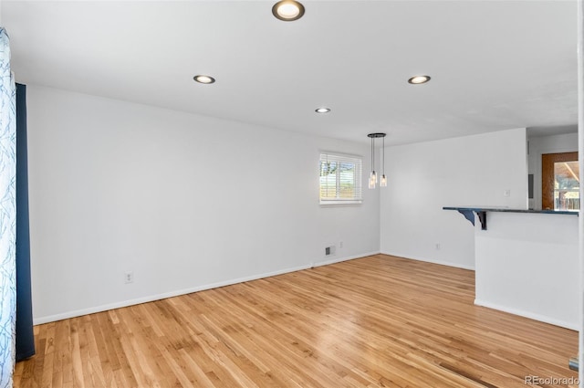 unfurnished living room with light hardwood / wood-style floors