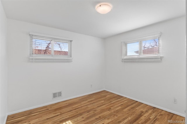 spare room featuring hardwood / wood-style floors