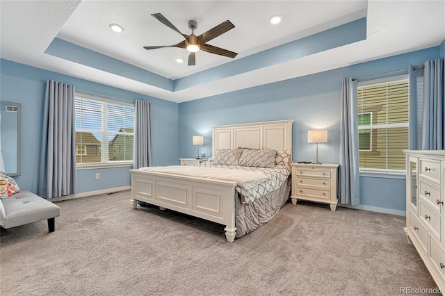 1066 S Eaton Park Ct, Aurora, CO 80018 - bedroom with a raised ceiling, light carpet, ceiling fan, and recessed lighting