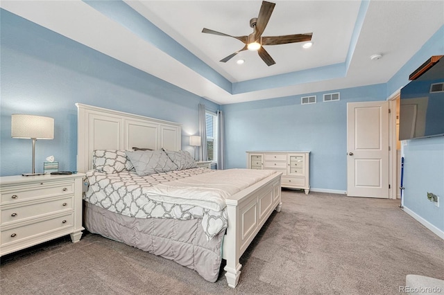 1066 S Eaton Park Ct, Aurora, CO 80018 - bedroom with a tray ceiling, carpet flooring, and a ceiling fan