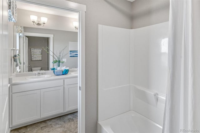 full bathroom with vanity, shower / bathtub combination, and toilet