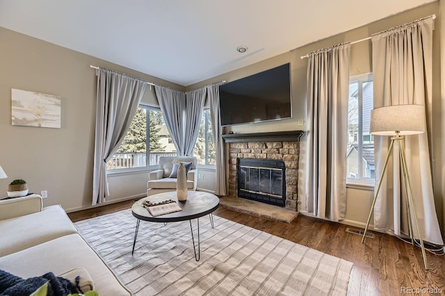 living room featuring a fireplace and hardwood / wood-style floors