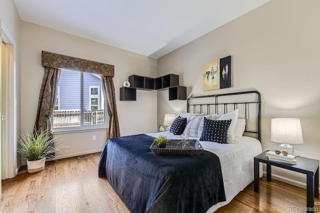 bedroom featuring hardwood / wood-style floors