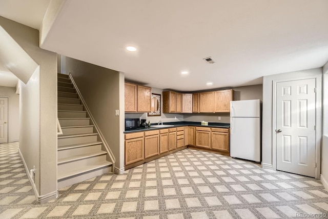 kitchen with white refrigerator and sink