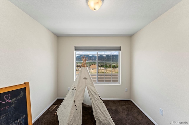 game room with carpet flooring and baseboards