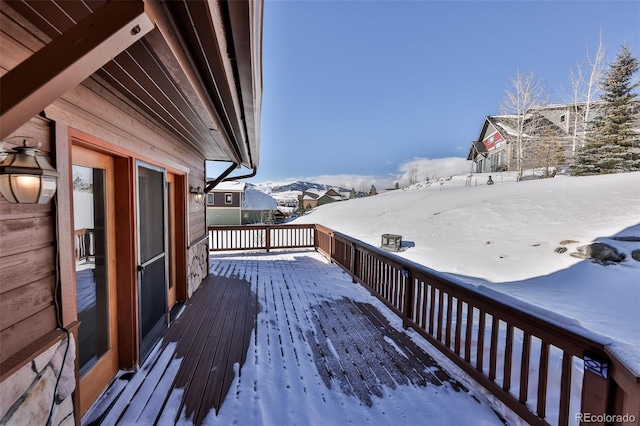 view of snow covered deck