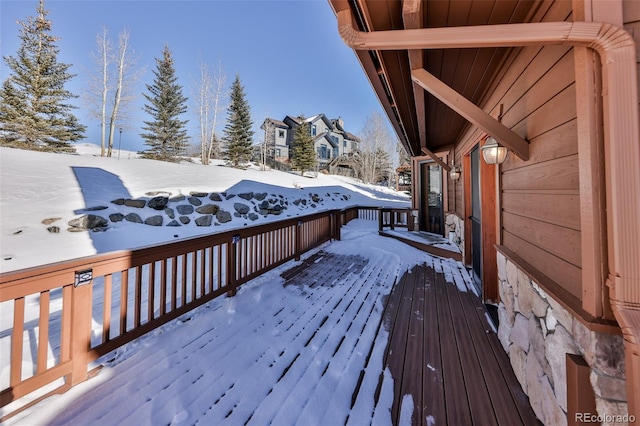 view of snow covered deck