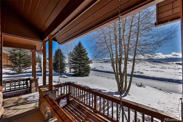 view of snow covered deck